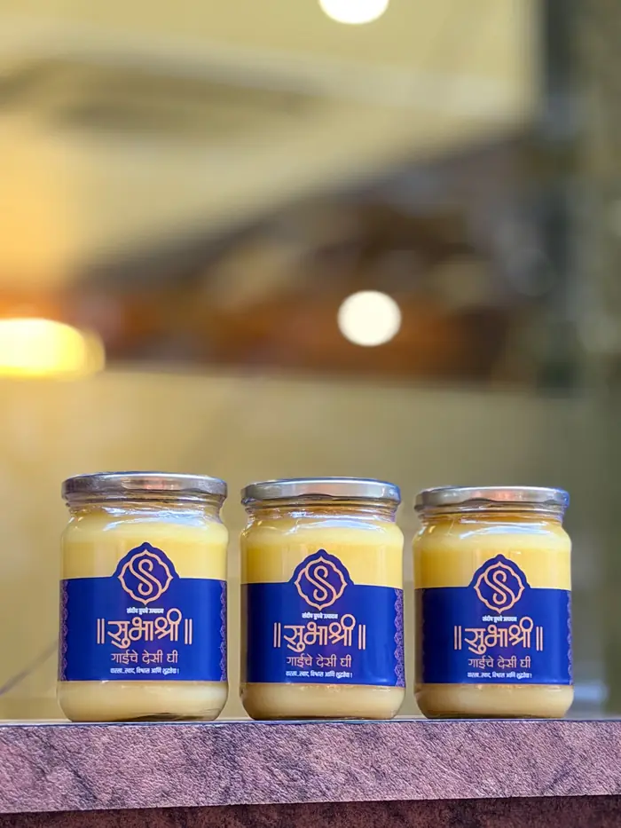Three jars of Subhashree cow ghee on a counter